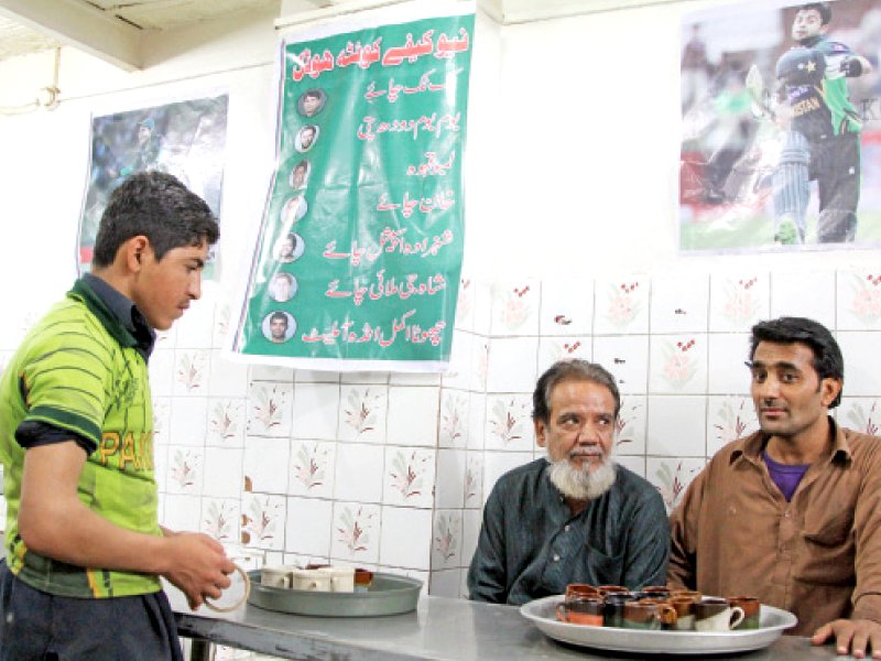 the tea shop with waiters clad in green jerseys is serving items such as the tuk tuk tea the khan chai the lambu kahva and even the chota akmal anda omelette photo aysha saleem express