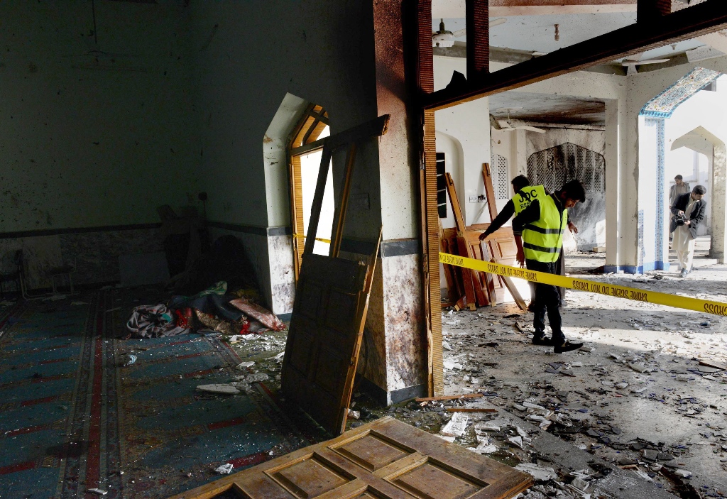 rescue workers remove the wreckage a day after a taliban militants 039 attack in a shia mosque in peshawar photo afp