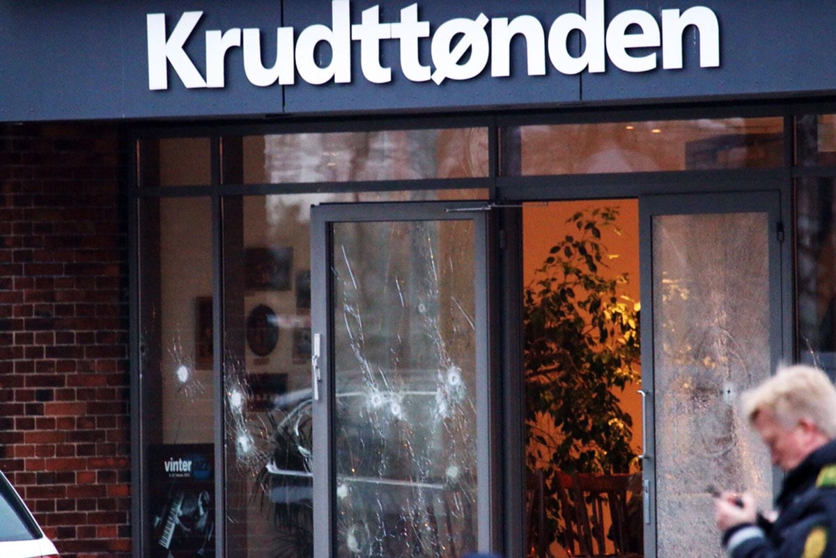 policemen secure the area around a building in copenhagen denmark where shots were fired on february 14 2015 outside the venue of a debate held on art blasphemy and free speech photo afp