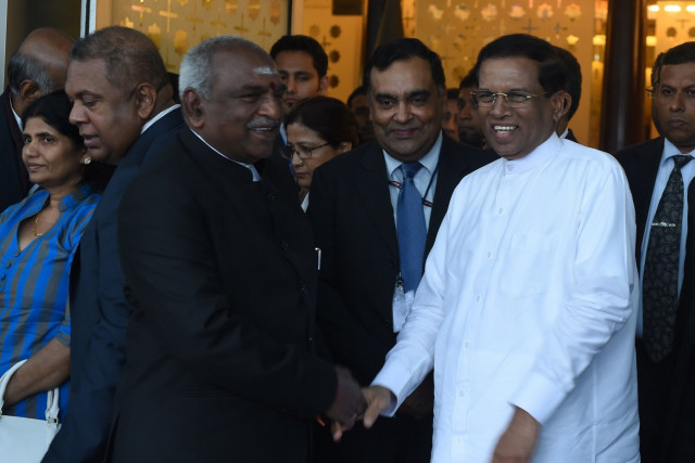 sri lankan president maithripala sirisena r is welcomed by indian minister of state for shipping p radhakrishnan at the indra gandhi international airport in new delhi on february 15 2015 photo afp sri lankan president maithripala sirisena r is welcomed by indian minister of state for shipping p radhakrishnan at the indra gandhi international airport in new delhi on february 15 2015 photo afp