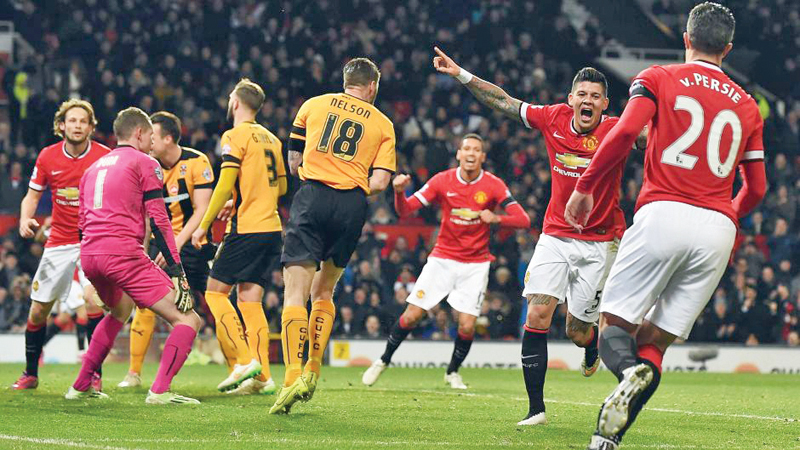 united defeated third tier yeovil town in the third round before they required a replay at old trafford to beat fourth tier cambridge united in the next one photo afp