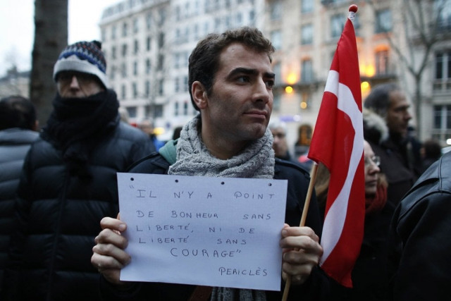 a protester holds a placard reading quot there is no happiness without freedom nor freedom without courage quot during a demonstration outside the embassy of denmark in paris on february 15 2015 a day after a gunman shot two people dead in copenhagen photo afp a protester holds a placard reading quot there is no happiness without freedom nor freedom without courage quot during a demonstration outside the embassy of denmark in paris on february 15 2015 a day after a gunman shot two people dead in copenhagen photo afp