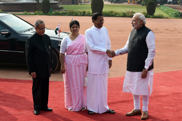 sri lankan president maithripala sirisena shakes hands with indian prime minister narendra modi as indian president pranab mukherjee and the first lady of sri lanka jayanthi pushpakumari look on during the welcome ceremony for the sri lankan dignatary at the presidential palace in new delhi on february 16 2015 photo afp sri lankan president maithripala sirisena shakes hands with indian prime minister narendra modi as indian president pranab mukherjee and the first lady of sri lanka jayanthi pushpakumari look on during the welcome ceremony for the sri lankan dignatary at the presidential palace in new delhi on february 16 2015 photo afp