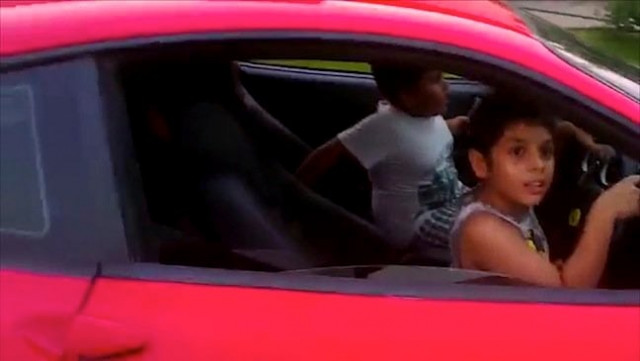 a screengrab of his 9 year old son driving a ferrari from a video posted online a screengrab of his 9 year old son driving a ferrari from a video posted online