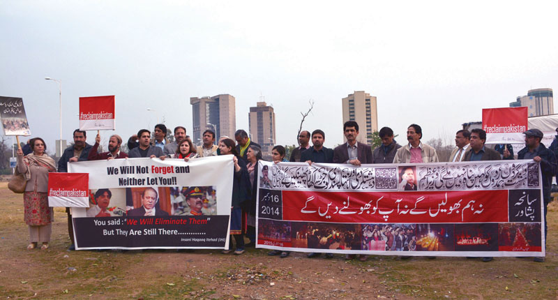 members of the civil society stand outside the press club on monday holding placards demanding that the army and government take action against perpetrators of sectarian and extremist violence in the country photo huma choudhary express