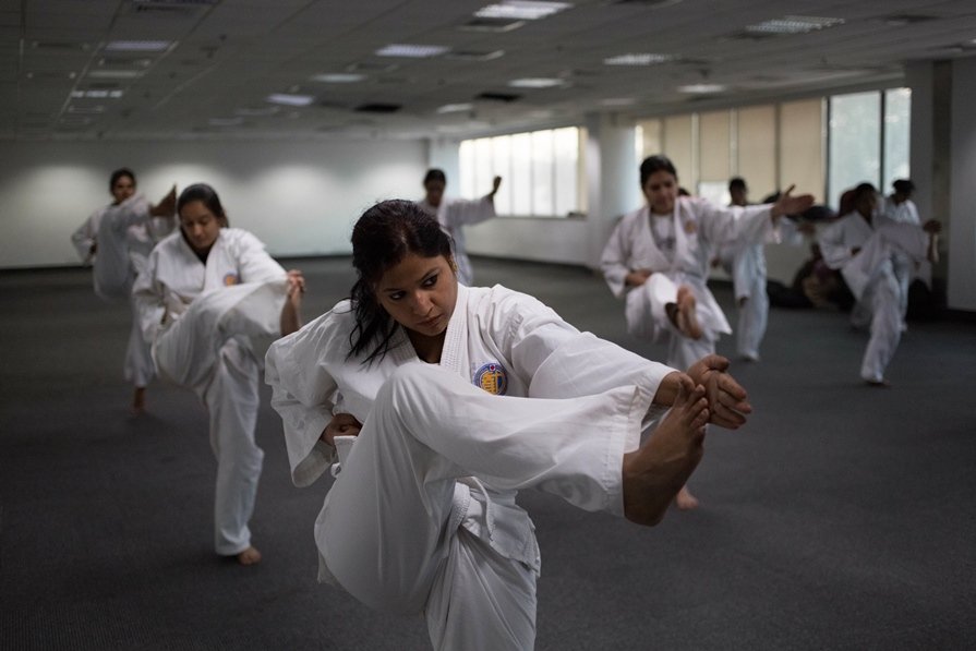 indian policewomen practice kicks during a self defence class in new delhi photo afp
