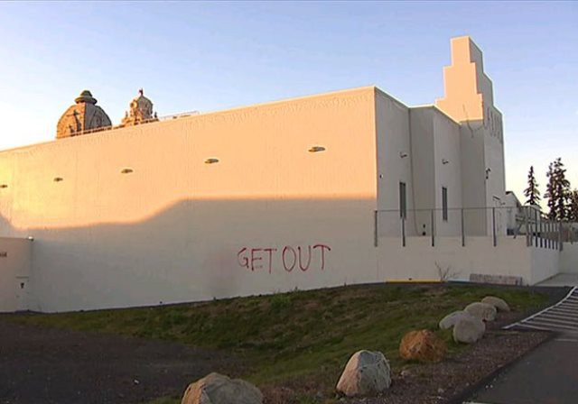 unidentified individuals sprayed the swastika and painted quot get out quot across one of the walls photo india tv unidentified individuals sprayed the swastika and painted quot get out quot across one of the walls photo india tv