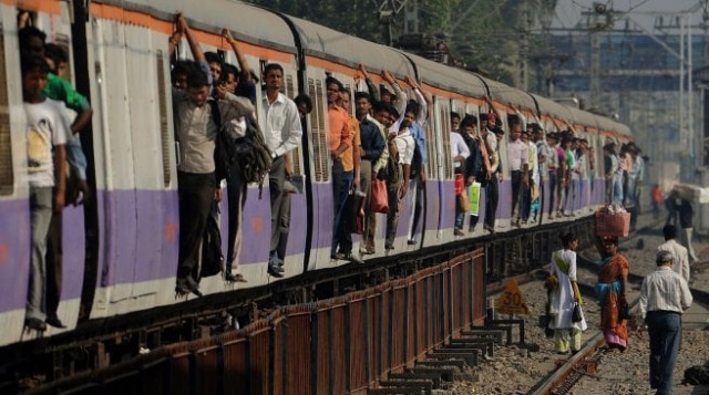 this 2011 file photograph shows indian commuters as they travel on an overcrowded train during rush hour at a suburban railway station in mumbai photo afp this 2011 file photograph shows indian commuters as they travel on an overcrowded train during rush hour at a suburban railway station in mumbai photo afp