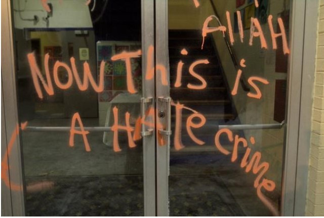 officials at the school said that the entrance was prayed with orange graffiti photo courtesy the providence journal officials at the school said that the entrance was prayed with orange graffiti photo courtesy the providence journal