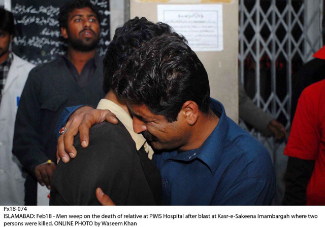 relatives of the victims comfort each other at pims hospital in islamabad photo online relatives of the victims comfort each other at pims hospital in islamabad photo online