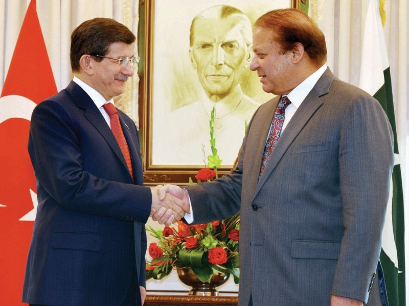 prime minister nawaz sharif greets his turkish counterpart ahmet davutoglu in islamabad photo afp