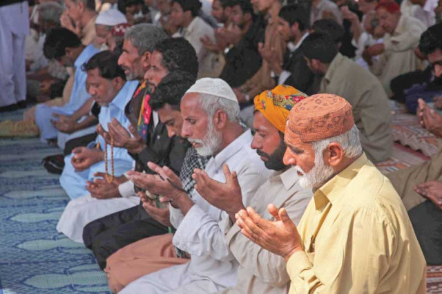 families seeking military operation against banned outfits in upper sindh protested at numaish chowrangi and held special prayers on wednesday photo athar khan express