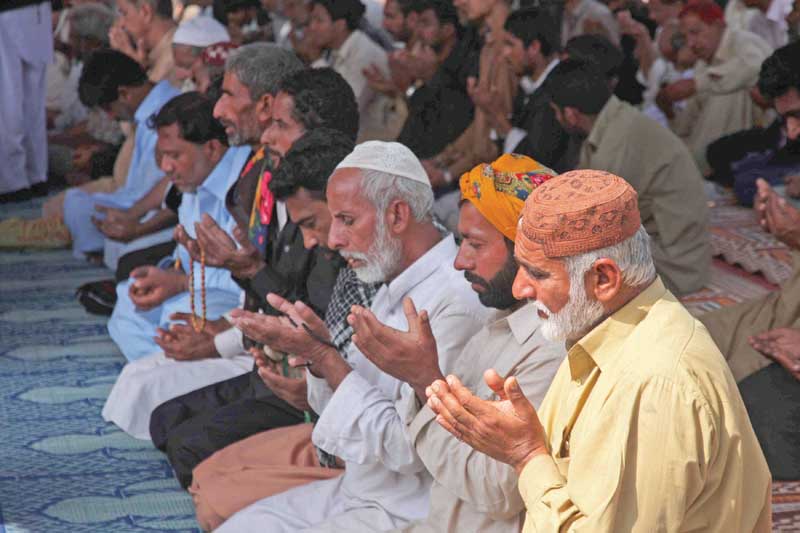 families seeking military operation against banned outfits in upper sindh protested at numaish chowrangi and held special prayers on wednesday photo athar khan express