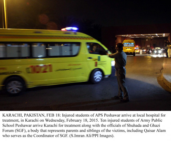 an official directs ambulances carrying aps school students and teacher as they arrive at the aga khan hospital for treatment photo ppi an official directs ambulances carrying aps school students and teacher as they arrive at the aga khan hospital for treatment photo ppi