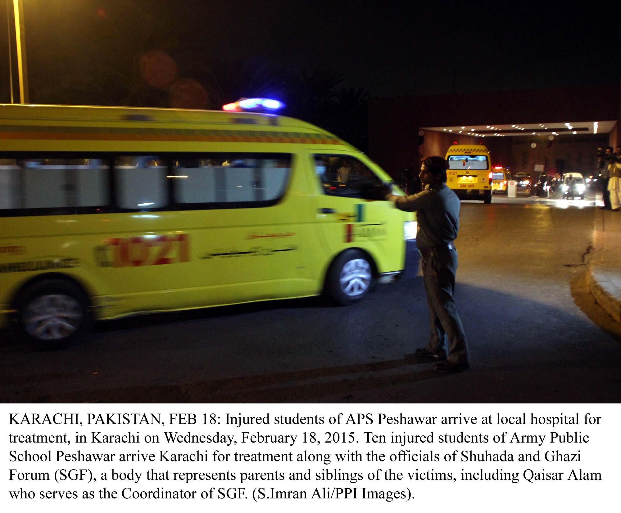 an official directs ambulances carrying aps school students and teacher as they arrive at the aga khan hospital for treatment photo ppi