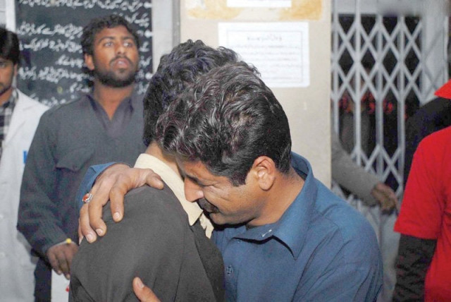 men weep at the death of their relative in the blast at the qasr e sakina imambargah photo online men weep at the death of their relative in the blast at the qasr e sakina imambargah photo online