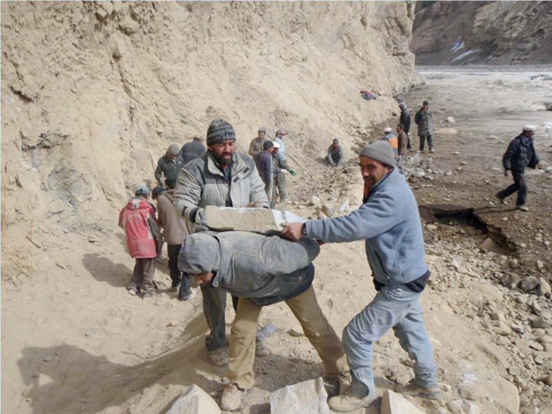 a group of men flatten the land smash rocks and cut through the mountains photo courtesy abdul joshi