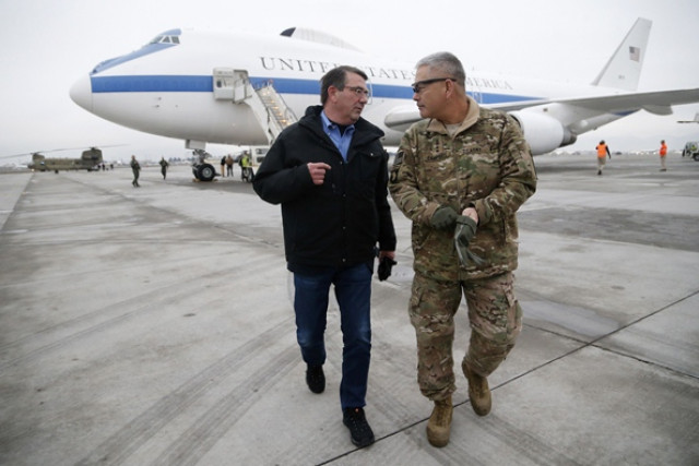us secretary of defense ashton carter l walks with us army general john campbell who greeted him upon his arrival at hamid karzai international airport in kabul photo afp