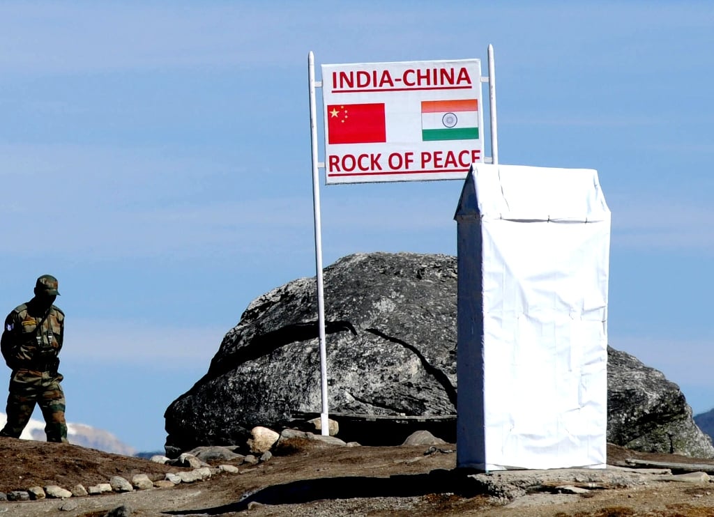 in this photograph taken on october 21 2012 an indian army soldier patrols at bumla pass on the india china border in the eastern indian state of arunachal pradesh photo afp file