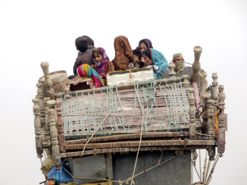 an afghan family leaves a refugee camp in the outskirts of karachi the sindh government has decided to establish more refugee camps for afghan nationals outside the city photo file