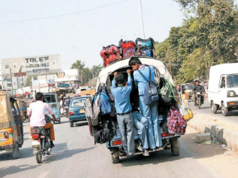 students cling precariously onto an overloaded school van speakers at the workshop on saturday lamented the blatant disregard for traffic rules and safety standards by school van operators photo file