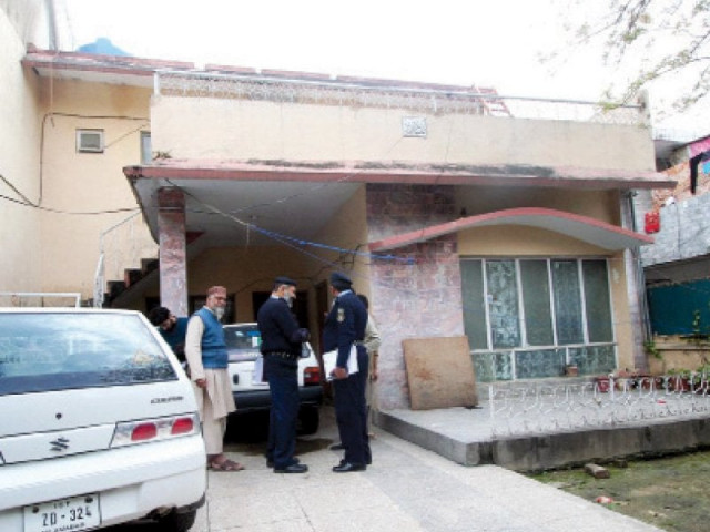policemen stand at the house where the incident took place photo online policemen stand at the house where the incident took place photo online