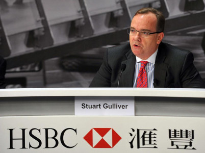 hsbc boss defends swiss account as bank s profits slump