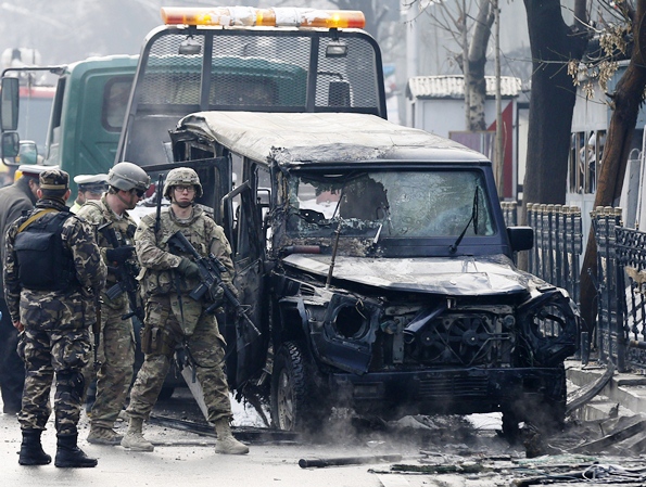 us soldiers arrive at the site of a suicide attack in kabul a suicide bomber rammed a vehicle laden with explosives into a turkish embassy car in the afghan capital on thursday killing at least one person inside the ministry of interior said photo reuters