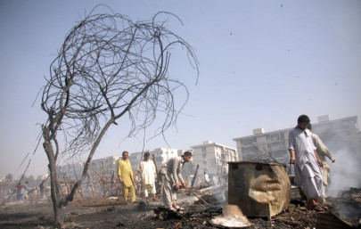 mystery fire burns down 50 makeshift huts