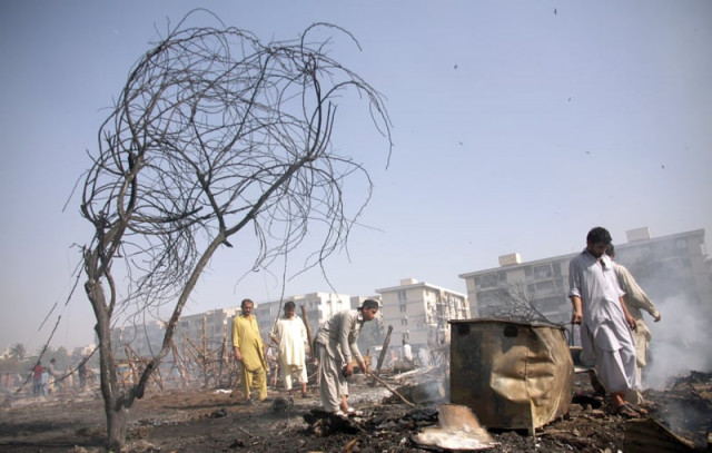 at least 50 makeshift huts were completely demolished when a fire broke out in gulshan e iqbal photo athar khan express at least 50 makeshift huts were completely demolished when a fire broke out in gulshan e iqbal photo athar khan express