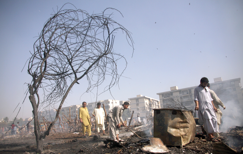 at least 50 makeshift huts were completely demolished when a fire broke out in gulshan e iqbal photo athar khan express