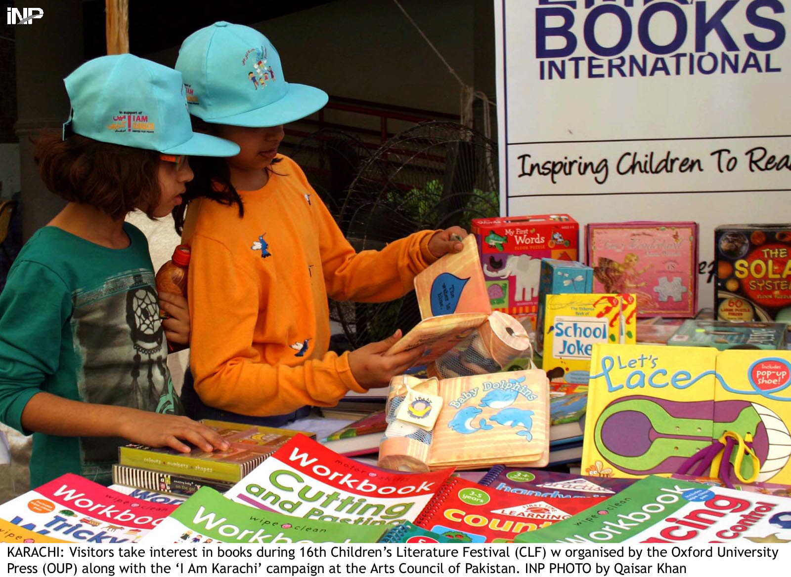 two children look at books during the children 039 s literature festival photo inp