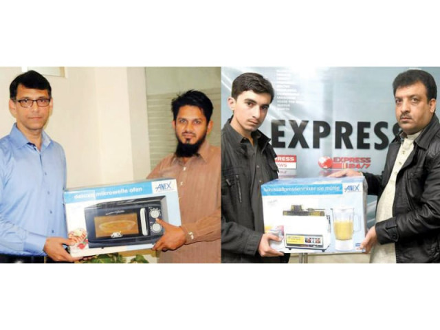 karachiite shahid siddiqui receives express publication and mcdonald s sponsored gift from express media group s associate director marketing in karachi karman ahmad while quetta s mohammad umar gets prize from express news quetta bureau chief razaur rahman photo express karachiite shahid siddiqui receives express publication and mcdonald s sponsored gift from express media group s associate director marketing in karachi karman ahmad while quetta s mohammad umar gets prize from express news quetta bureau chief razaur rahman photo express