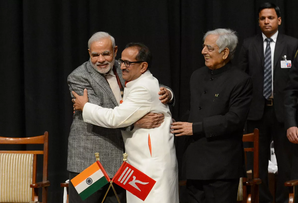indian prime minister narinder modi l and jammu and kashmir deputy chief minister nirmal singh c embrace as jammu and kashmir chief minister mufty mohammed sayeed r looks on during a swearing in ceremony of the state assembly in jammu on march 1 2015 photo afp indian prime minister narinder modi l and jammu and kashmir deputy chief minister nirmal singh c embrace as jammu and kashmir chief minister mufty mohammed sayeed r looks on during a swearing in ceremony of the state assembly in jammu on march 1 2015 photo afp