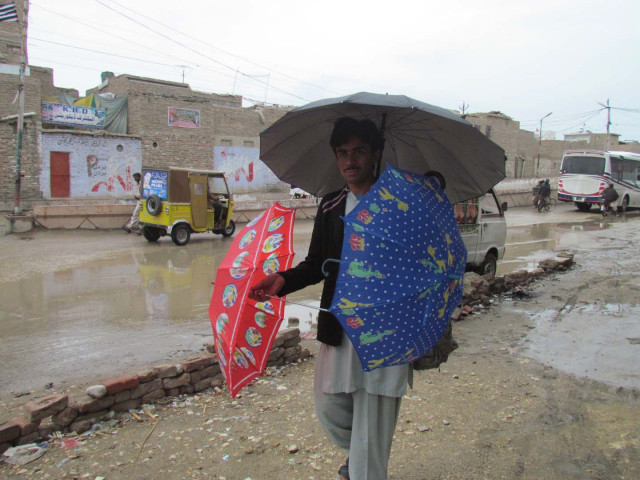 a man in sukkur sells umbrellas after a rainfall in the city on sunday march 1 2015 photo naeem ahmed ghouri express a man in sukkur sells umbrellas after a rainfall in the city on sunday march 1 2015 photo naeem ahmed ghouri express