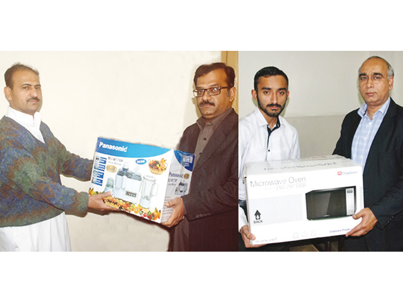 on behalf of express media group daily express editor editorials in lahore latif chaudhry and daily express chief reporter in peshawar yousuf khan handing over the prizes to the winners photo express