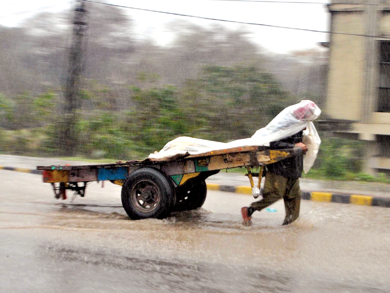 commuters had to face a traffic nightmare in the twin cities due to the incessant rainfall on monday photo zafar aslam express inp