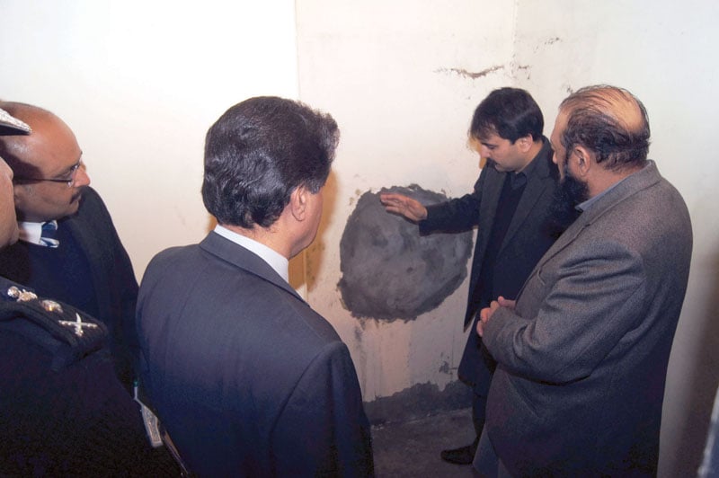 home secretary sibtain ahmed shows the hole through which the prisoners fled the jail photo courtesy sajjadul haq