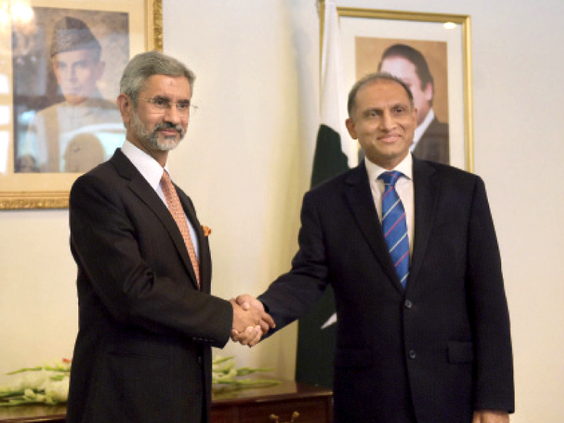 foreign secretaries of pakistan and india shake hands before the meeting photo afp