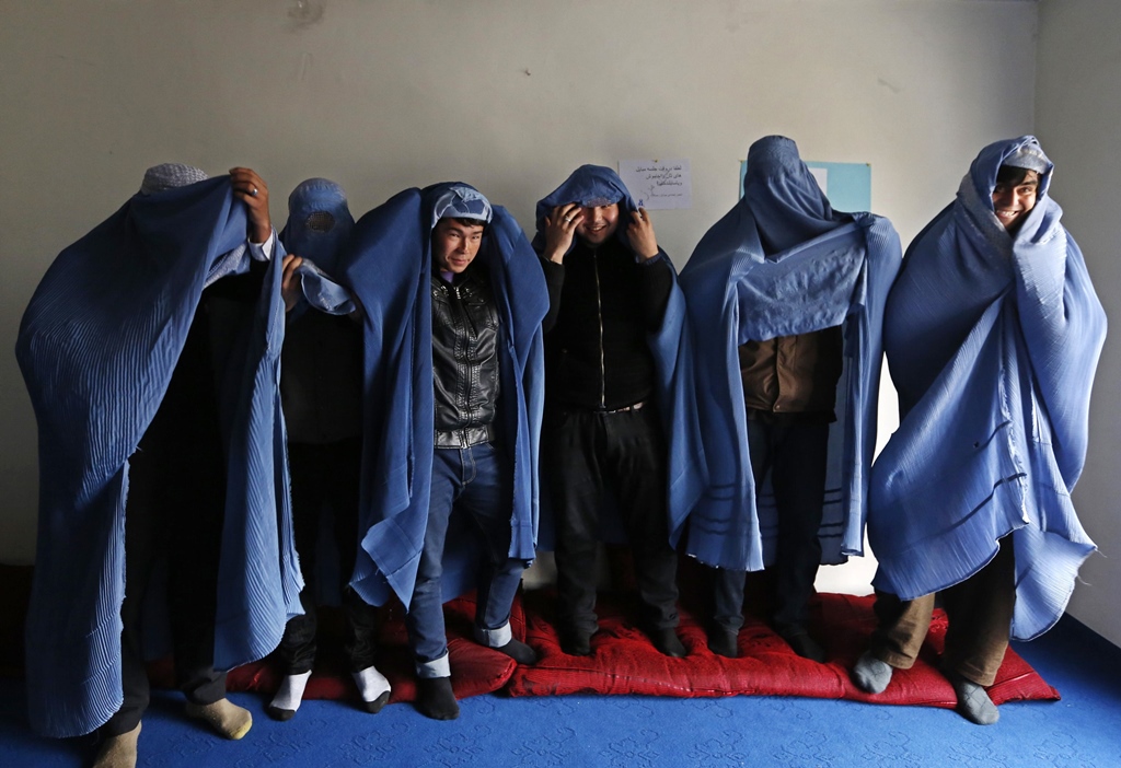 male afghan women 039 s rights activist pose for media as they wear burqas to show their solidarity to afghan women ahead of international women 039 s day in kabul march 5 2015 photo reuters