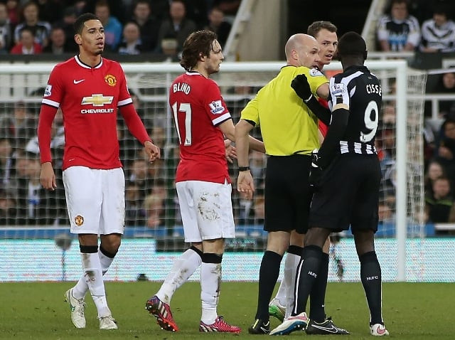 spit row manchester united defender johnny evans got involved in a spit row with newcastle forward papiss cisse as the northern irishman appeared to spit on the senegalese as he was getting off the turf for which the striker responded in kind photo afp spit row manchester united defender johnny evans got involved in a spit row with newcastle forward papiss cisse as the northern irishman appeared to spit on the senegalese as he was getting off the turf for which the striker responded in kind photo afp