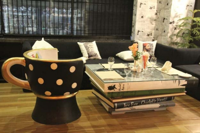 the sitting space at cafe page 102 has been designed on the pattern of a library photo ayesha mir express