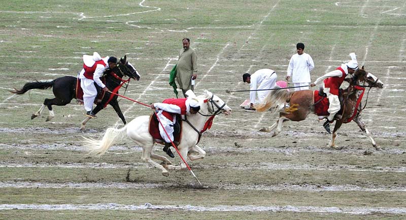 tent pegging competition on the opening day of the show top motorcycle stunts being performed by army men above photos app