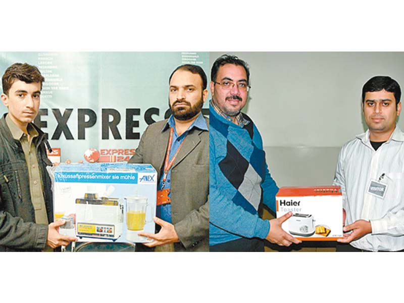 bureau chief of express news in lahore mohammad ilyas and express media group s assistant manager marketing in quetta tanvir ahmed hand over the prizes to the winners photo express