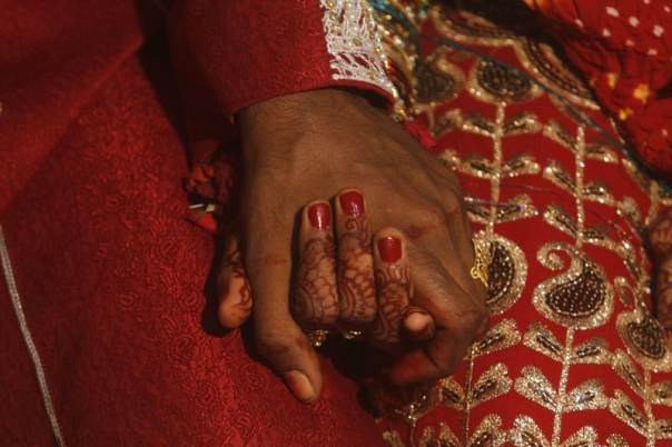a file photo of a bride and groom hold hands during a marriage ceremony photo reuters