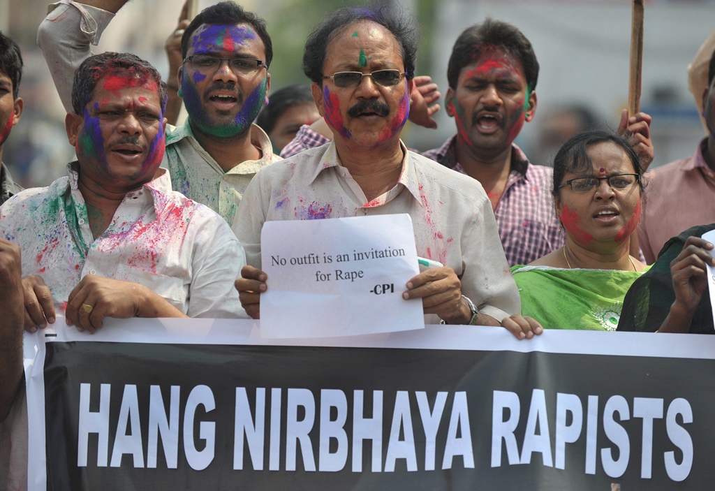activists of the communists party of india cpi hold placards during their protest against the rapists of delhi student nirbhaya in hyderabad on march 6 2015 photo afp