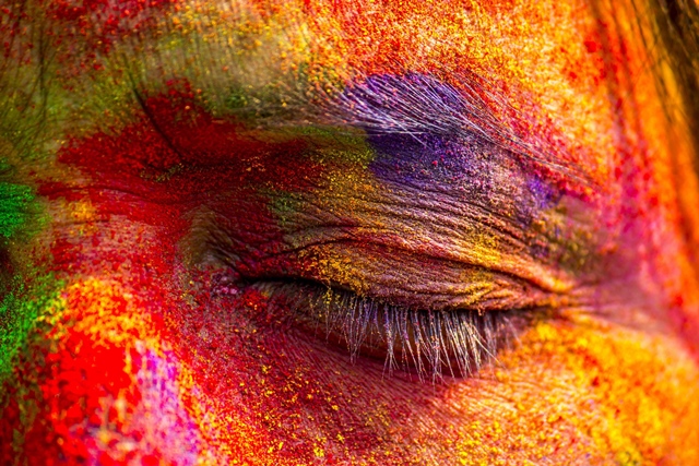 an indian woman 039 s face is smeared with colored powder during celebrations of the holi festival in the sivasagar district of northeastern assam state on march 6 2015 photo afp