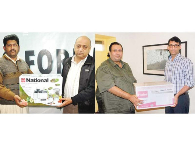 associate director marketing kamran ahmed in karachi and express media group s assistant business manager shahzad mughal in faisalabad hand over the prizes to the winners photo express associate director marketing kamran ahmed in karachi and express media group s assistant business manager shahzad mughal in faisalabad hand over the prizes to the winners photo express