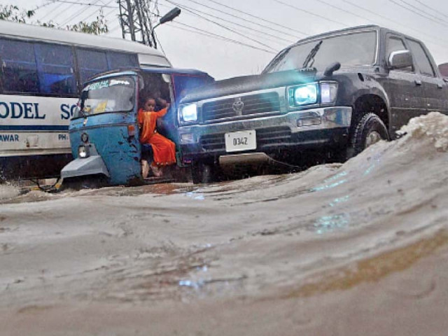 a car tries to make its way amid rain water accumulated on gt road photo inp a car tries to make its way amid rain water accumulated on gt road photo inp