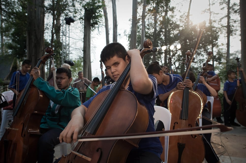 this picture taken on january 31 2015 shows joe of the thai blind orchestra performing during a rehearsal ahead of a concert at the thai elephants research and conservation fund in khao yai national park 180 km 112 miles north east of bangkok deftly feeling their way along the bumps of the braille score the young players of thailand 039 s first blind orchestra memorise scales defying both their impairment and ingrained negative attitudes towards disability photo afp